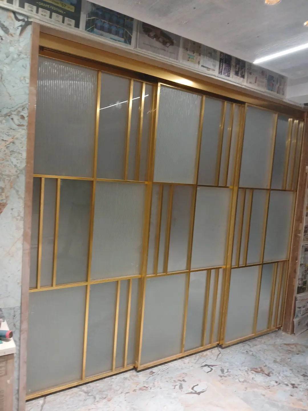 big partatation door golden finish glass door