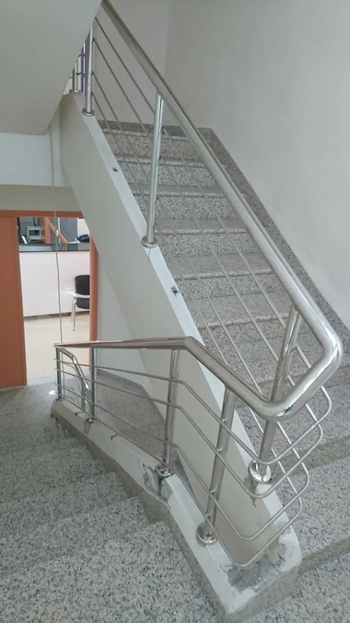 Designer stainless steel railing with wooden handrail finish