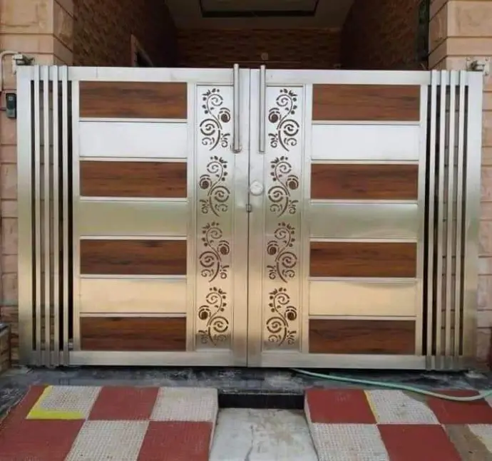 Elegant stainless steel and wooden gate designed for strength, privacy, and a modern look.